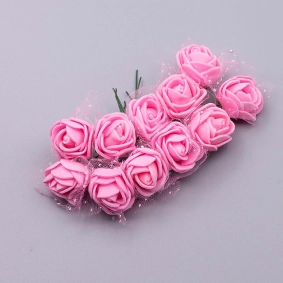 Small handmade pink foamiran rose buds for crafts and floral arrangements